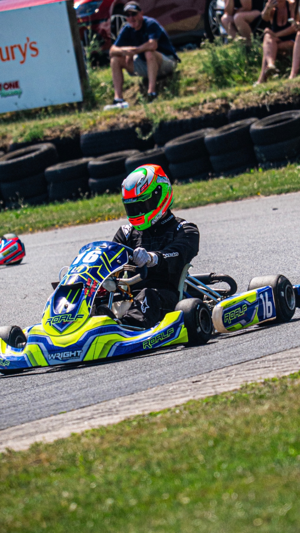 Presley Walker cornering hard in the Roalf Racing #16 kart