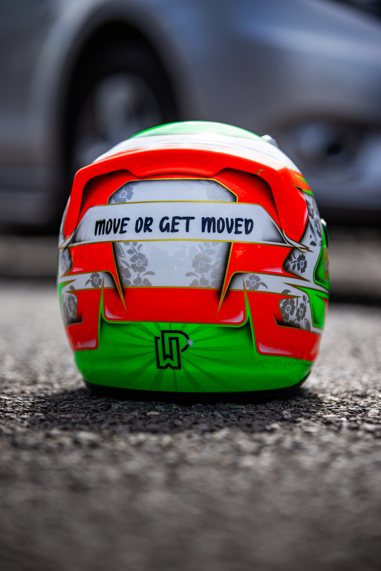 Rear of Presley Walker's helmet reading Move or Get Moved